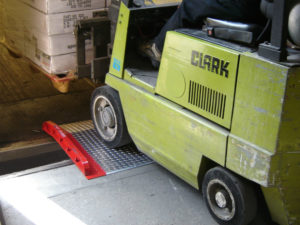 how to unload a truck or container without a loading dock handiramp